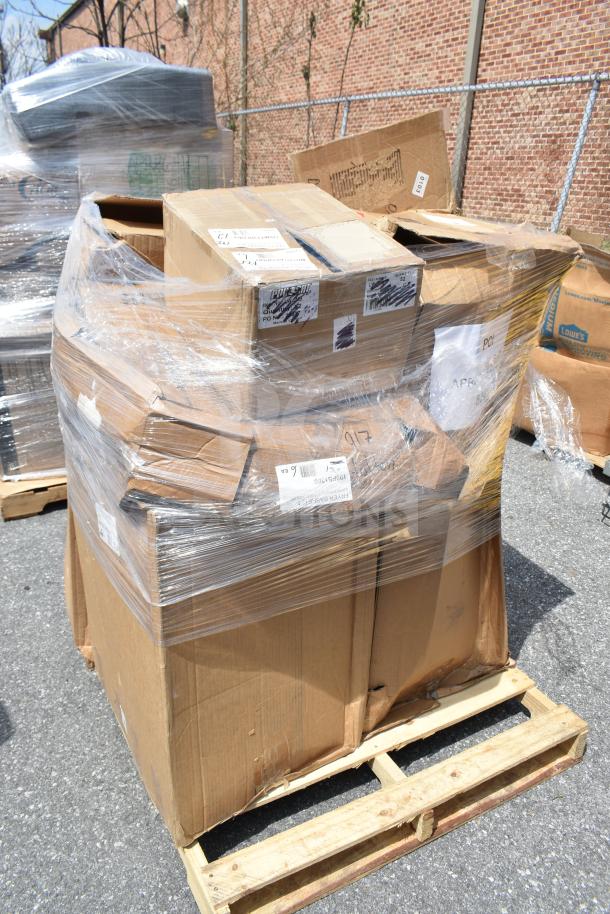 6 new scratch and dent items on a pallet, including mini taco holders and fryer baskets. Boxes shrink-wrapped, mixed labels visible.