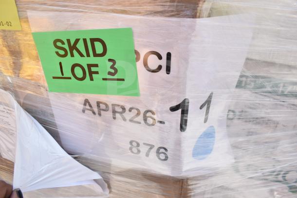 Skid wrapped in plastic with label "SKID 1 OF 3" and text "APR26-11". Contains 24 scratch and dent items.