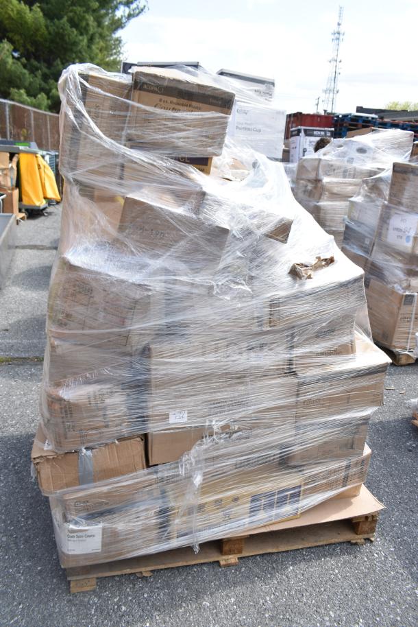 Wrapped pallet of assorted scratch and dent items including plates, glasses, and containers in cardboard boxes. Ideal for bulk buyers.