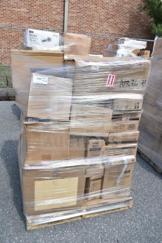 Stack of boxes labeled APR26-93 containing brand new scratch and dent items like glasses and cake pans, wrapped on a pallet.