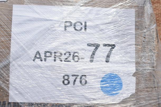 Plastic-wrapped package labeled "PCI APR26-77." Contains 30 new scratch and dent items, including lunch trays, containers, and lids.