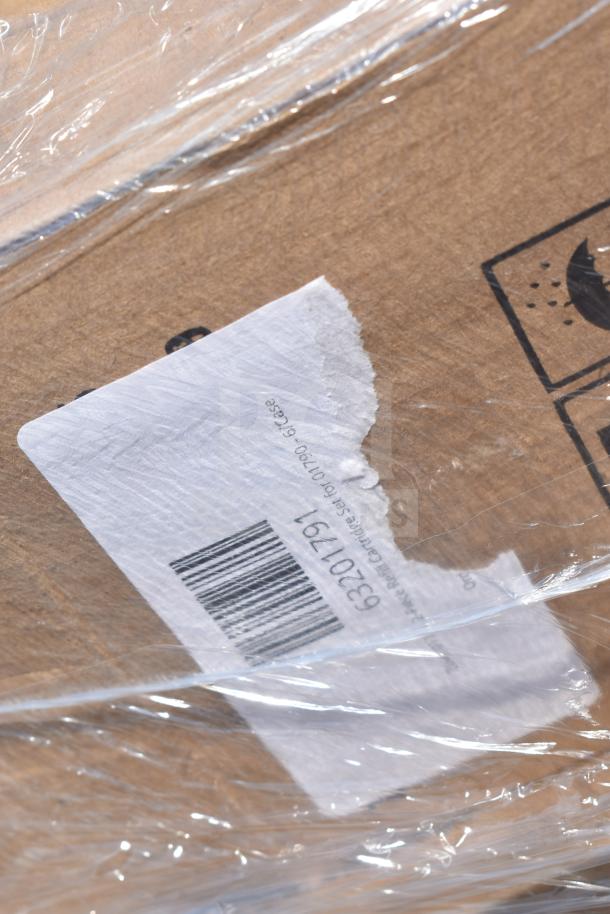 Cardboard box with shipping label showing barcode, partially visible under clear wrapping. Contains 29 new scratch and dent items.