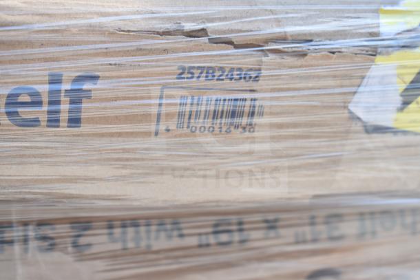 Cardboard box with visible barcode and numbers "257B24362," wrapped in plastic. Part of a lot featuring various kitchen items.