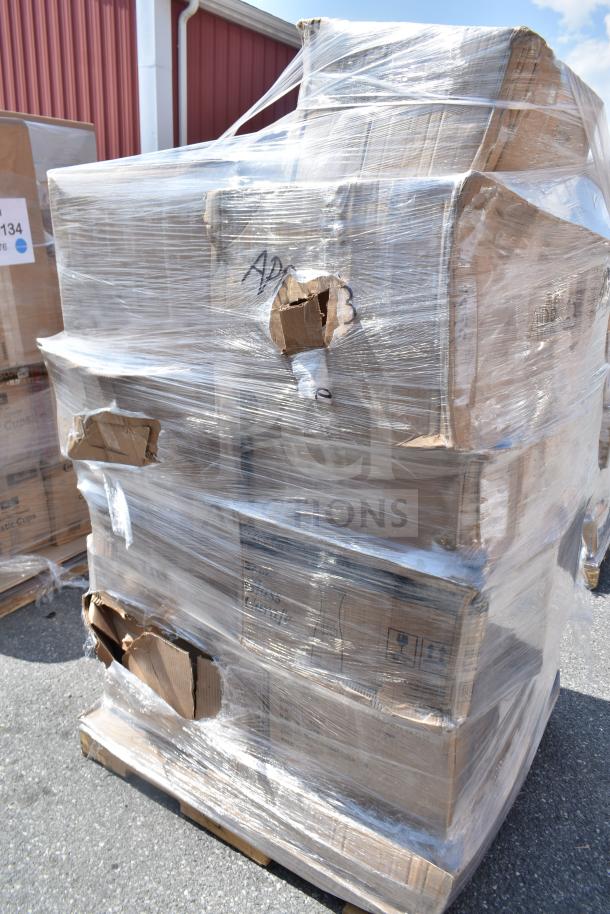 Shrink-wrapped pallet of scratch and dent boxes containing bowls, glasses, air filter, ramekins. Damaged packaging visible.