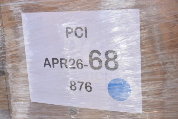 Pallet wrapped with plastic showing a label marked "PCI APR26-68 876" containing scratch and dent items like pastry bags and knives.