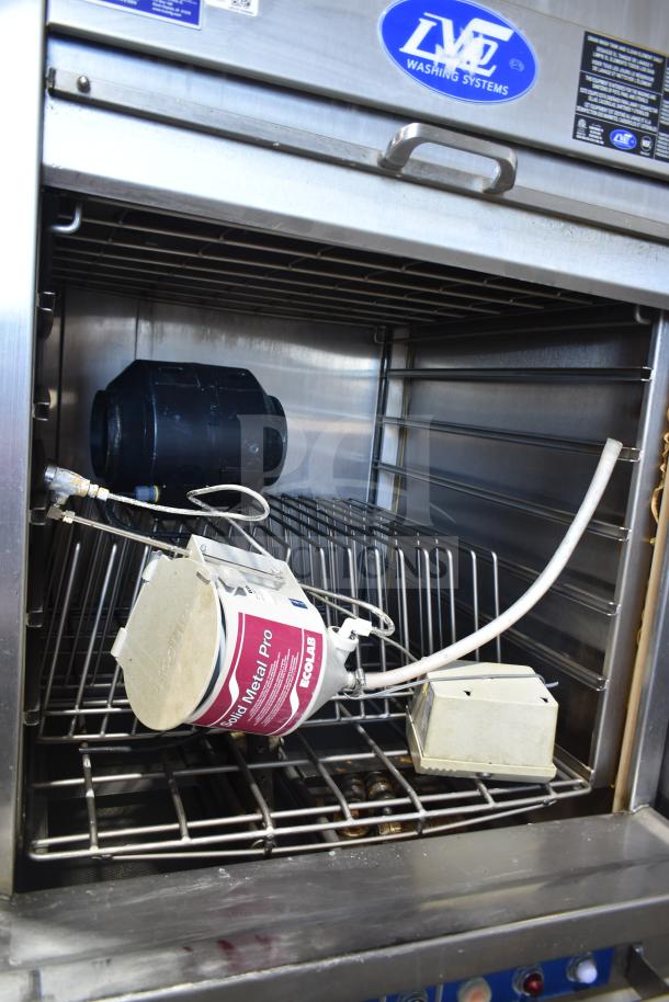 LVO FL14E stainless steel commercial pot and pan washer, front load, 460 volts, 3 phase. Interior view showing racks and detergent container.