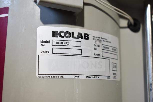 Ecolab Wash Max label on stainless steel equipment, indicating model and serial number, part of the LVO FL14E washer.