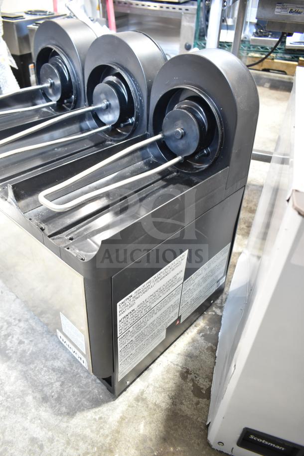 Narvon Commercial Countertop Drink Dispenser Base, black with three spouts, visible warning labels, in good condition.