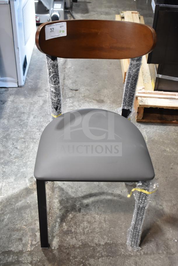 Brand new Lancaster dining chair, wooden back, gray cushion, metal frame. Scratch and dent condition. Auction tag visible.