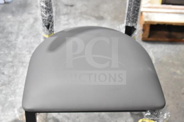 10 brand new Lancaster dining chairs. Wooden back, gray cushion, metal frame. Scratch and dent condition.