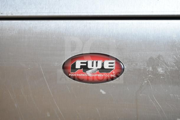 2017 FWE TS-1633-36P heated holding cabinet on casters, 115V, 1 phase, minor surface wear, FWE logo on front panel.