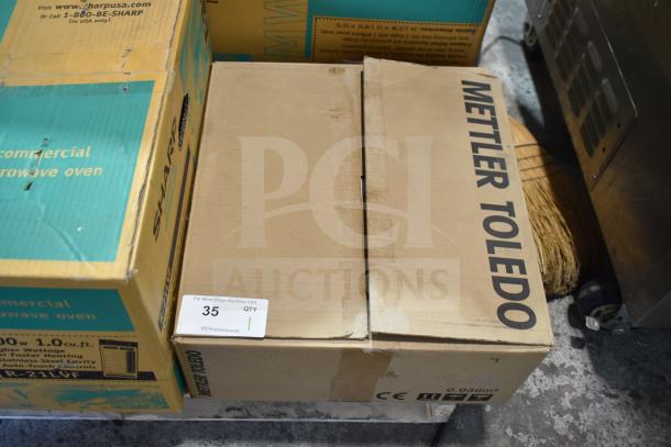 Mettler Toledo BC Commercial Countertop Food Portioning Scale in box, labeled with auction tag 35, in good condition.