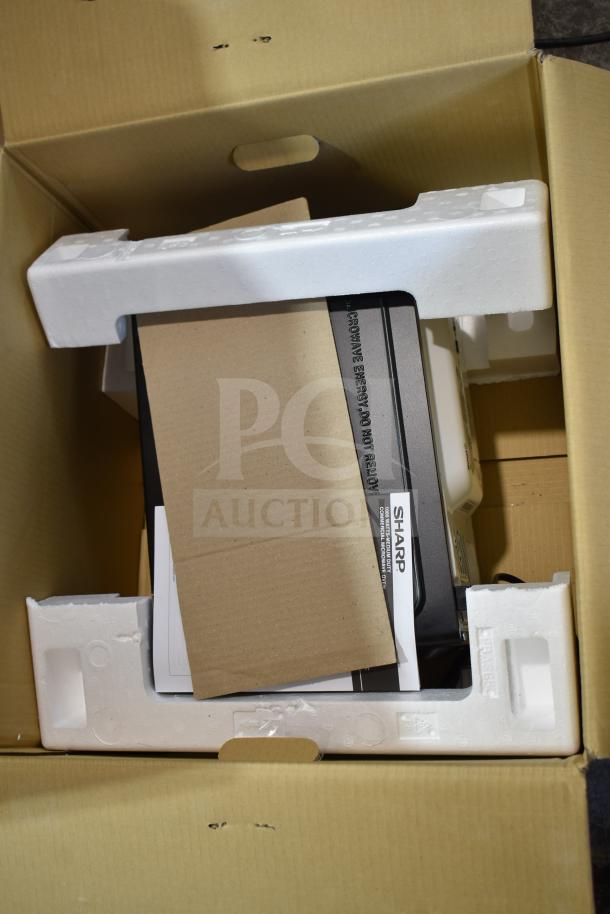 Brand new Hamilton Beach MS8436127995-01 countertop microwave in opened box, 120 volts, 1 phase, with minor scratches.