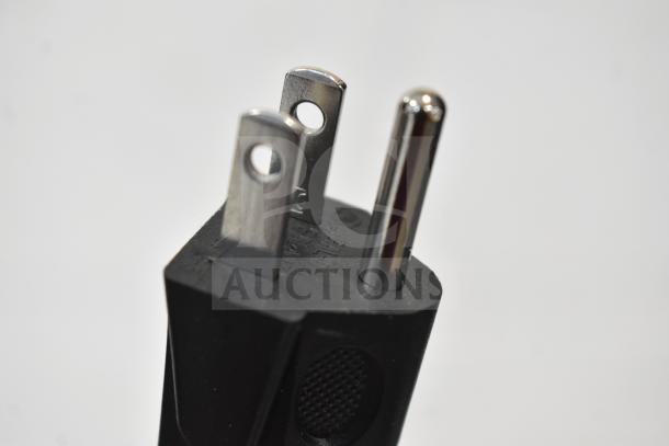 Close-up of a three-prong power plug for a 2025 Hamilton Beach MS8436127995-01 Countertop Microwave Oven.