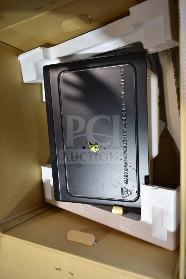 "2025 Hamilton Beach MS8436127995-01 countertop microwave, brand new, visible dent on top, 120 volts, 1 phase."