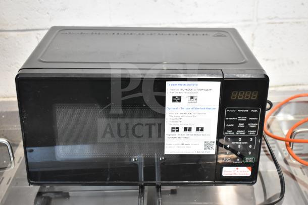 BRAND NEW 2025 Hamilton Beach MS8436127995-01 countertop microwave, 120V, 1 phase. Visible label shows control instructions.
