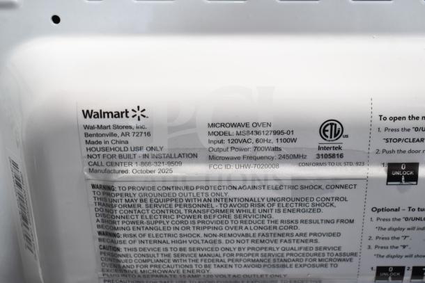 Alt text: New Hamilton Beach MS8436127995-01 countertop microwave oven, 120V, 1 phase, 1100W input, 700W output, model label shown.
