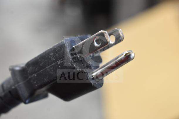 Close-up of a standard 3-prong power plug for the 2023 Sharp R-21LVF Commercial Countertop Microwave Oven.