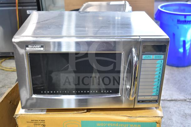 2024 Sharp R-21LVF commercial countertop microwave oven, 1000W, stainless steel, keypad controls, excellent condition.
