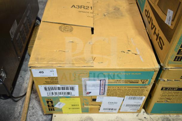2024 Sharp R-21LVF Commercial Countertop Microwave Oven in original packaging. New condition. Box shows shipping labels.