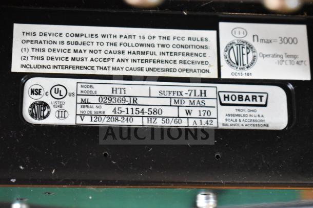 2016 Hobart HTi-7LH commercial scale label showing model, serial number, voltage, and compliance details. Tested and working.