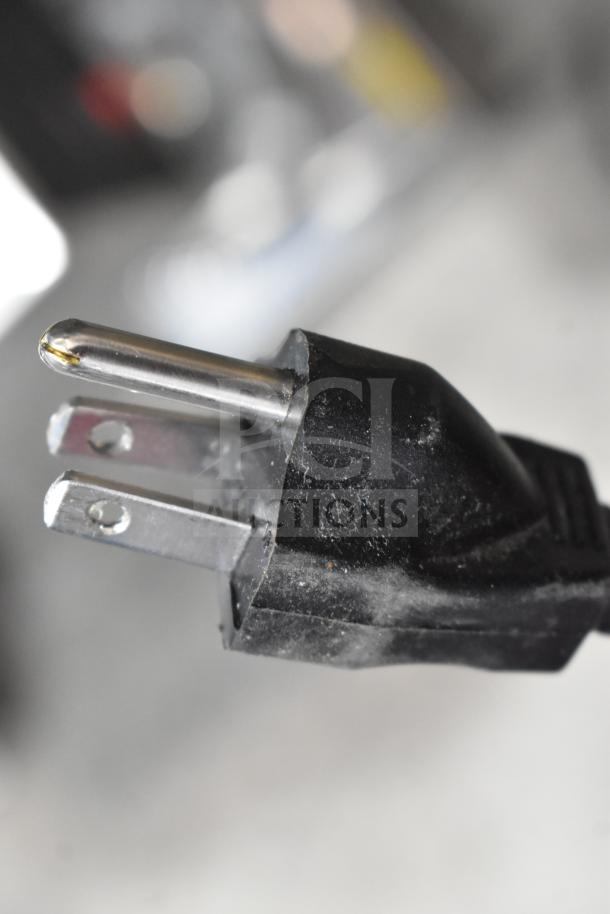 Close-up of a plug for a 2025 Bunn VPR 33200.0015 coffee brewer, 120 volts, 1 phase.