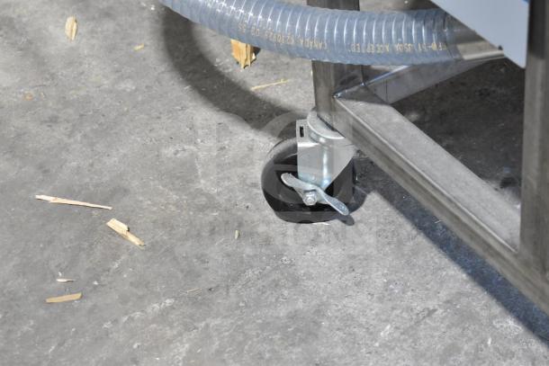 Belshaw TG50 Thermoglazing Station on casters, 208V, 1 phase. Shown: commercial caster wheel, metal frame, hose connection.