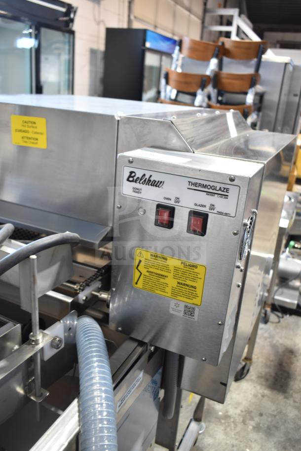 Belshaw TG50 Thermoglazing Station, 208V, 1 Phase, on casters. Features warning labels and control panel with branding.