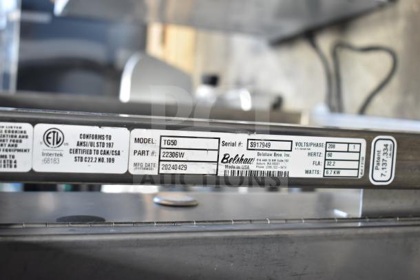 Belshaw TG50 Thermoglazing Station, 208V, 1 Phase, with commercial casters. Visible label with model and specs.