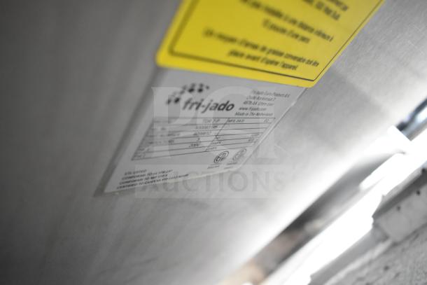 Fri-jado TDR7-P rotisserie oven label showing model, voltage, and phase details. Electric-powered, on casters.