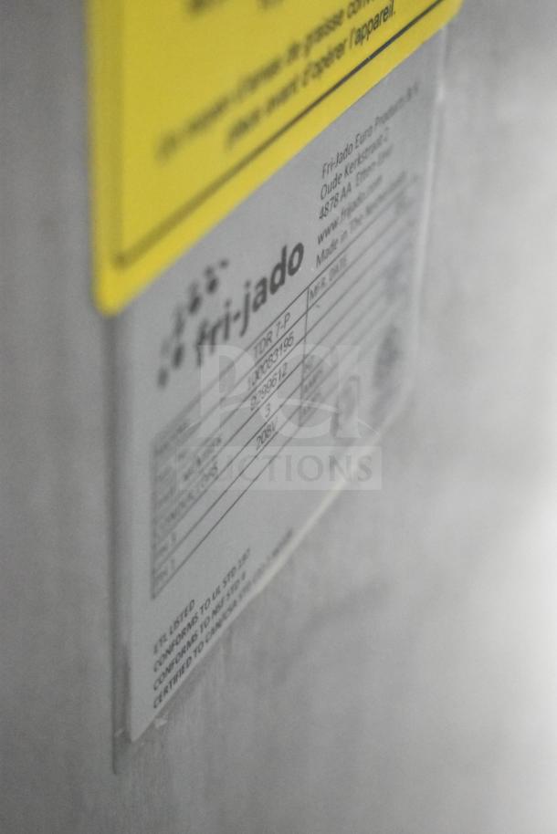 Fri-jado TDR7-P commercial rotisserie oven label showing model, serial number, 208V, 3-phase, on commercial casters.