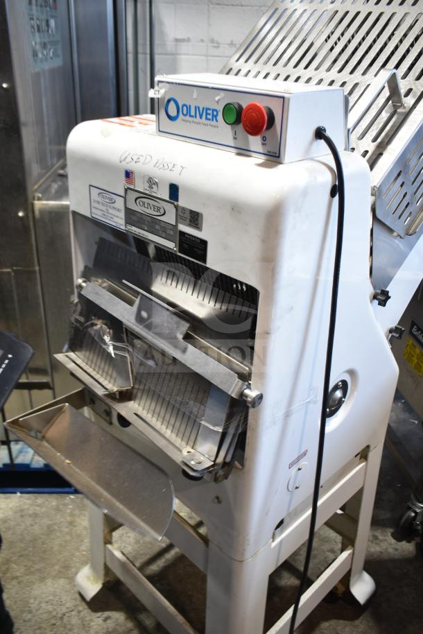 Oliver 797-32NC commercial bread loaf slicer with Pro Guard safety chute. Features include floor style design, 115V, signage visible.