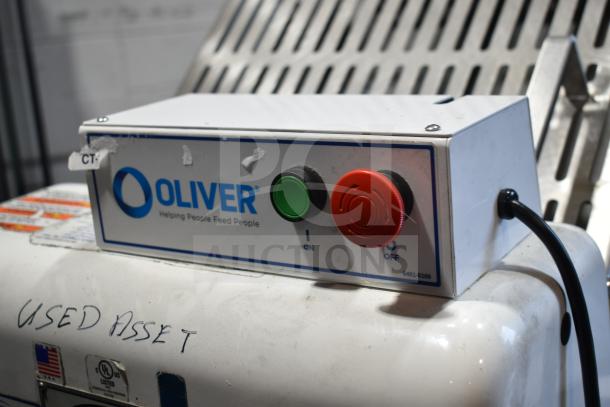 Oliver 797-32NC bread slicer, 115V, with Pro Guard safety chute. Used condition. Control panel with on/off buttons visible.
