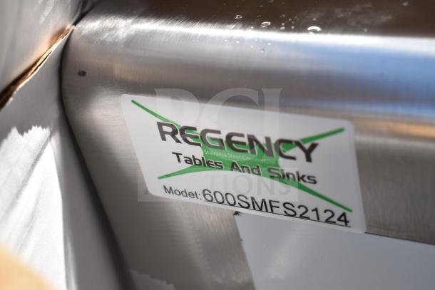 Regency stainless steel table and sink, model 600SMFS2124, shown with label. New condition, slight imperfections.