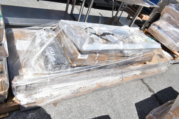 Seven new scratch and dent items including pan rack and wire shelves. Wrapped on pallets, marked with lot number 134.