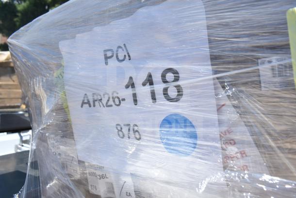 Plastic-wrapped package with label "PCI APR26-118." Contains new scratch and dent items. Suitable for auction bidding.