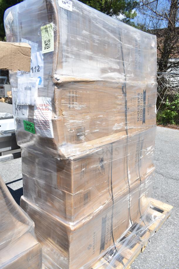 Shrink-wrapped pallet of four Lancaster Table & Seating Axel outdoor barstools. Boxes labeled "Outdoor Barstool." Tags visible.