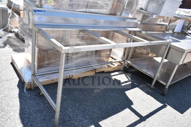 Stainless steel Universal Cutting Table Frame, sturdy, open design, used condition, ideal for industrial or kitchen setups.