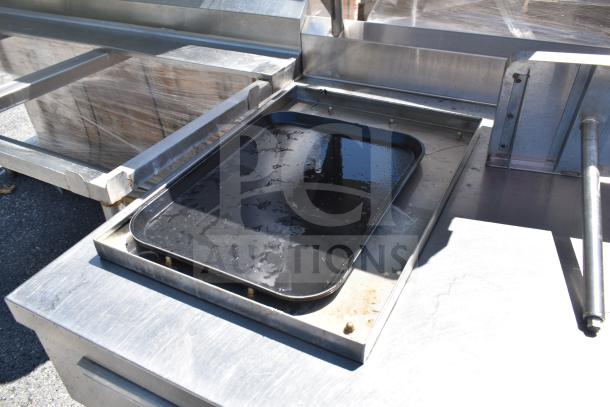 Commercial prep table with 4 round cutouts, 2 drawers with sauce pot cutouts, and commercial casters. Durable condition.