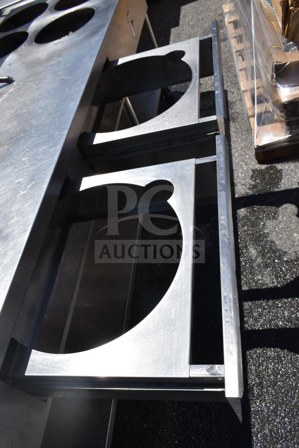 Commercial prep table with 4 round cutouts, 2 drawers featuring sauce pot cutouts, mounted on commercial casters.