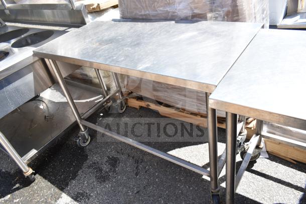 Stainless steel commercial table on casters, features durable construction. Ideal for kitchen use, good condition.