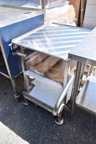 Face to Face Commercial Meat Slicer Equipment Stand, stainless steel, multi-tier design, with caster wheels for mobility.