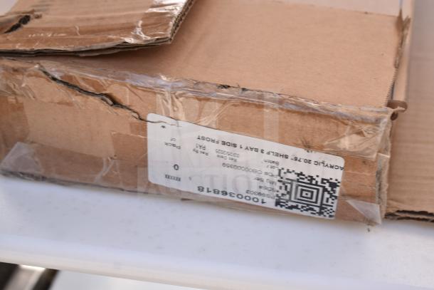 Damaged cardboard box for Face to Face Commercial Meat Slicer Equipment Stand, showing a label with a QR code and product details.