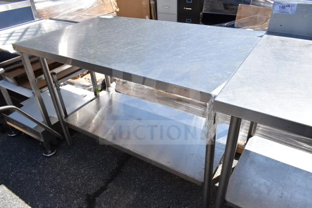 Commercial stainless steel table with under shelf, excellent condition, ideal for industrial or kitchen use.