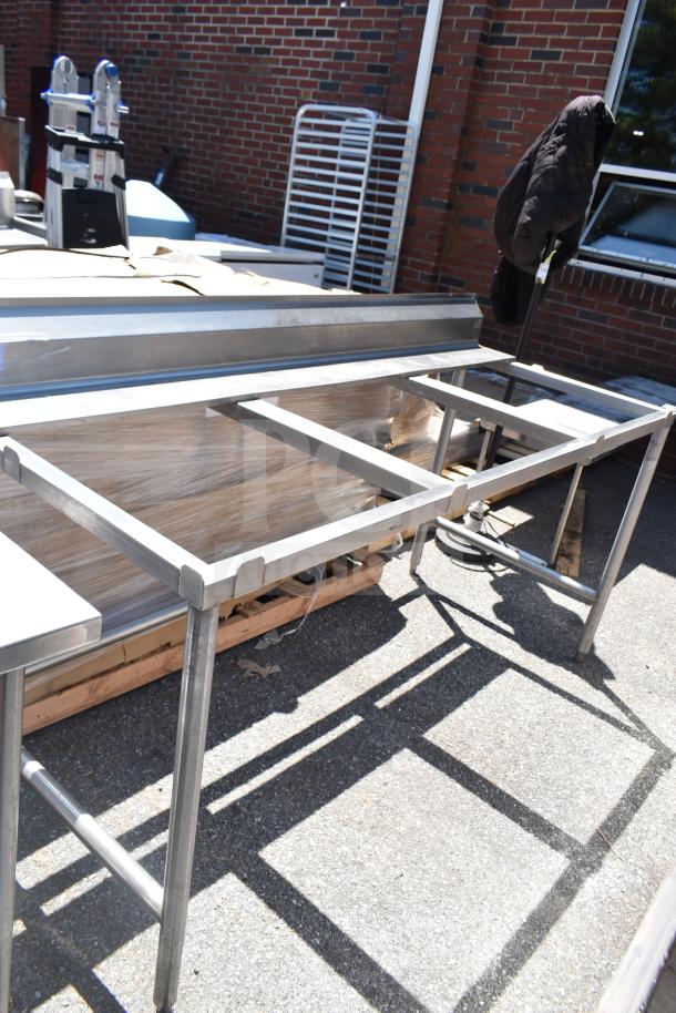 Universal Commercial Cutting Table Frame, stainless steel construction, sturdy design, outdoor setting, gently used condition.