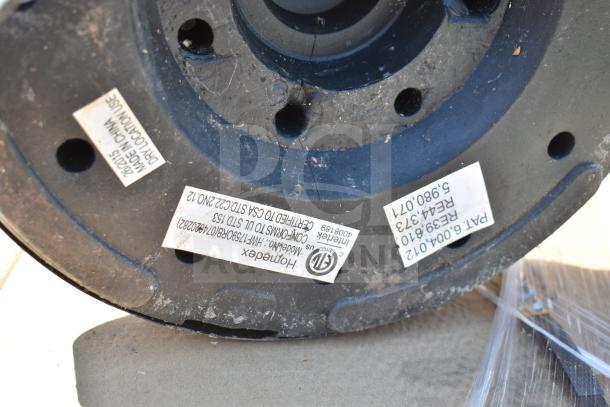 Close-up of a Homedex lamp base with visible certification labels and part numbers. Item is in used condition.