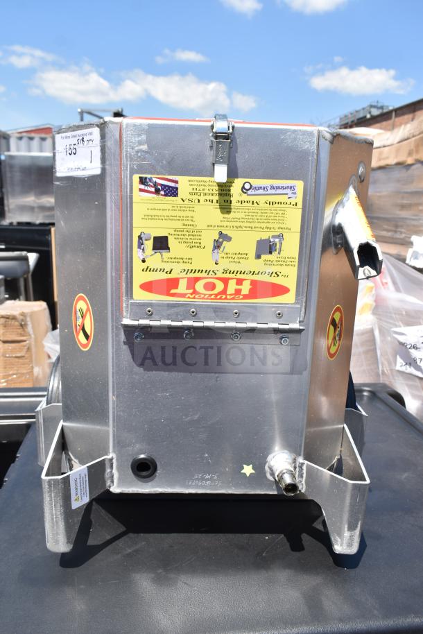 Brand new Shortening Shuttle Pump with minor scratches. Features warning labels and instructional sticker. Sturdy metal body.