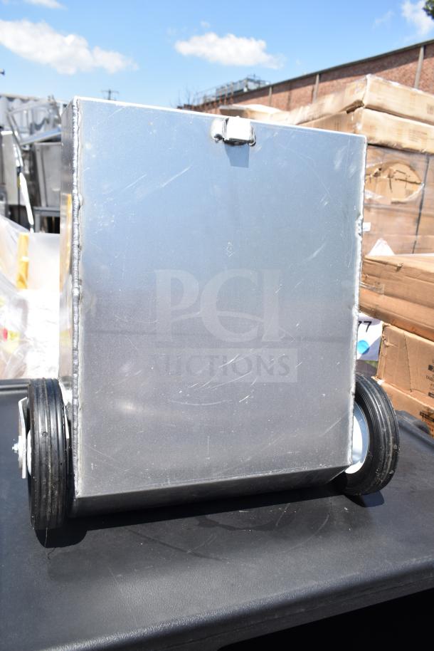 Brand new shortening shuttle pump with visible scratches and dents, metal construction, and wheels for mobility.