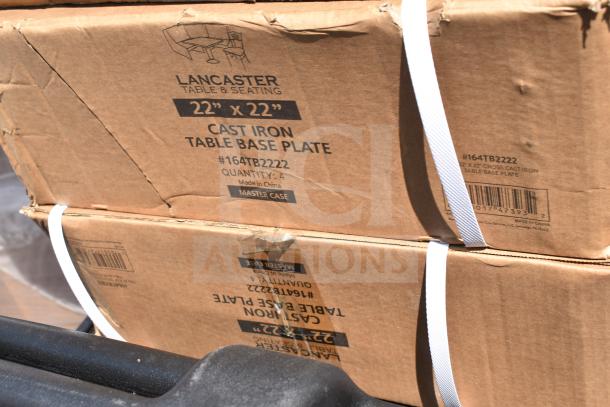 Two boxed Lancaster Table & Seating cast iron table base plates, model #164TB2222, each 22"x22", new condition.