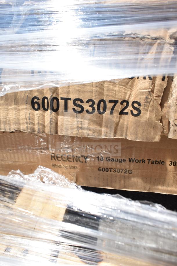 Cardboard box labeled "600TS3072S" containing Regency 18-gauge work table, wrapped in plastic. New condition.